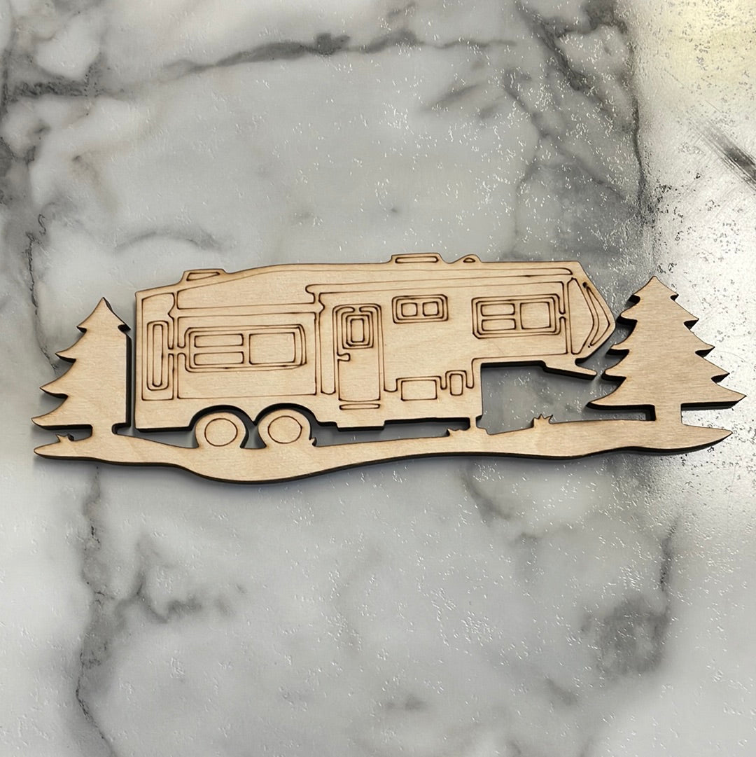 Wooden fifth wheel trailer with trees